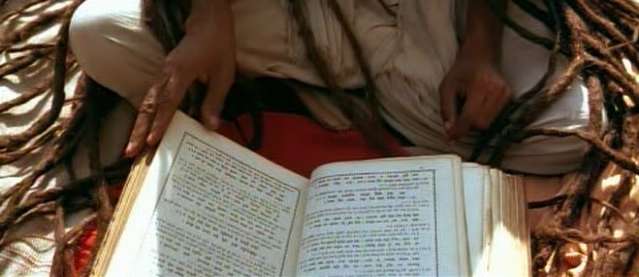 A  Hindu 'Sadhu'(Hermit) reading holy texts