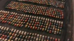 Docks where import cars where first unloaded in the 1970s?  It looks like VW Buses and, maybe, some Renault LeCars.