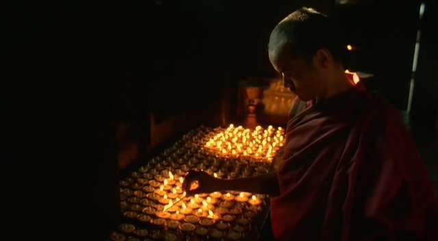 Butterlamp offerings.  108 butterlamps made of yak butter are lit as an offering to Tara or Medicine Buddha.  Prayer: OM TARE, TU TARE, TURE SOHA. Tibetan ritual.