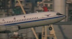 This is a shot of a Boeing 707 taking off from the now-demolished Kai Tak Airport in Kowloon Bay, Ho