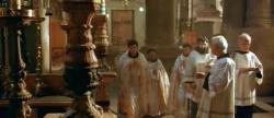 Priests praying inside the Church of the Holy Sepulchre in Jerusalem